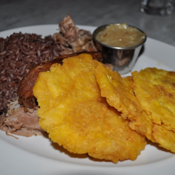 Lechon Asado with Tostones and Moro Rice